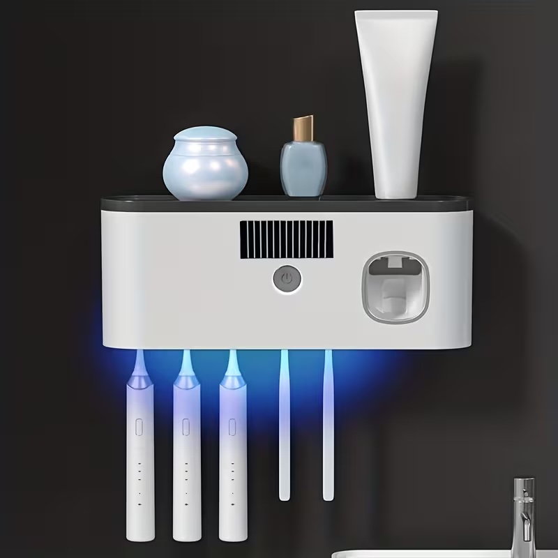 Five toothbrushes glowing under the Neat Flow UV-C sanitizing light